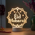 Lamp intricately crafted with Eid Mubarak message, festive ambiance