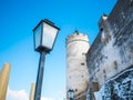 Lamp light fortress castle blue sky salzburg austria winter snow Royalty Free Stock Photo