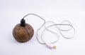 Lamp made from coconut shells on white background