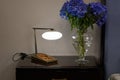 Lamp, nightstand and flowers Royalty Free Stock Photo