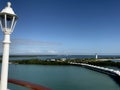 Lamp post with an aerial view of Harvest Caye in Belize Royalty Free Stock Photo