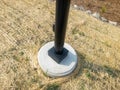 A lamp post on concrete