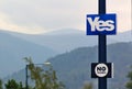 Lamp post with election posters of the referendum on Scottish independence, mountains, forest and trees Royalty Free Stock Photo