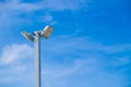 Lamp post electricity industry with blue sky background. Spotlight tower. Royalty Free Stock Photo