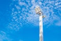 Lamp post electricity industry with blue sky background. Spotlight tower. Royalty Free Stock Photo