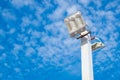 Lamp post electricity industry with blue sky background. Spotlight tower. Royalty Free Stock Photo