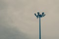 Lamp post electricity industry with blue sky background. Spotlight tower, vintage tone. Royalty Free Stock Photo