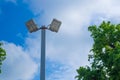 Lamp post electricity industry with blue sky background and tree Royalty Free Stock Photo