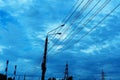 Lamp post with wires on the background of the cloudy sky. Outdoor power lines. Selective focus Royalty Free Stock Photo