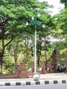 Lamp posts stand tall on the edge of the town square