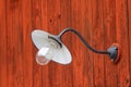 Lamp on a red barn wall Royalty Free Stock Photo