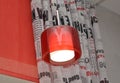 The lamp with a red plafond against a portiere and rolshtor Royalty Free Stock Photo