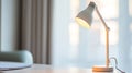 A lamp is on a table in front of a window Royalty Free Stock Photo