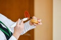 Lamp for teeth. Dentist using dental treatment with UV lamp on the patient`s teeth. Healthy mouth. A stomatologist packs on a moc Royalty Free Stock Photo