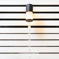 Lamp on white lath wall Royalty Free Stock Photo