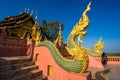 Lampang, Thailand - December, 19, 2022 : Serpent railing with blue sky background at Wat Phra That Doi PhraChan in Lampang,