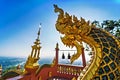 Lampang, Thailand - December, 19, 2022 : Serpent railing with blue sky background at Wat Phra That Doi PhraChan in Lampang,