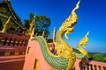 Lampang, Thailand - December, 19, 2022 : Serpent railing with blue sky background at Wat Phra That Doi PhraChan in Lampang,