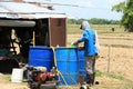 2023-05-01:Lampang Thailand:The farmers are preparing to mix herbicide into several large containers of water