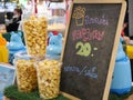 2023-07-01:Lampang Thailand:Freshly Popped Popcorn in Glass at a Vibrant Food Festival