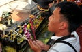 Lampang, Thailand: Man Praying with Incense