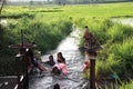 2023-05-01:Lampang Thailand:Many children were having fun playing in the small canal at the rice fields