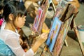 Asian little girl study and learning paint on canvas in the art classroom of her school