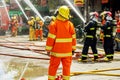 Firefighters group of Lampang city confederate water spray and control the hoses