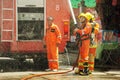 Firefighters group of Lampang city confederate water spray and control the hoses to quench