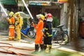 Firefighters group of Lampang city confederate water spray and control the hoses to quench