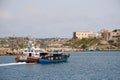 Wooden boat with migrants in board