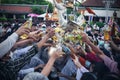 LAMPHUN, THAILAND - MAY 15, 2022: Monks and people pour auspicious water into large bowls to pay homage to the Buddha`s relics Royalty Free Stock Photo