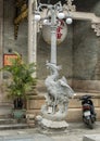 Lampost with symbolic phoenix on a turtle, Cantonese Assembly Hall in Hoi An. Royalty Free Stock Photo