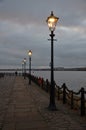 lamposts and love padlocks by the river mersey in liverpool Royalty Free Stock Photo