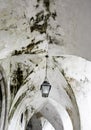 Lamppost in ancient arch