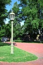 Lamppost on a lawn and footpath near Peter and Paul Fortress in Saint Petersburg Royalty Free Stock Photo