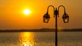 Lamppost with river and sunset Royalty Free Stock Photo