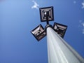 Lamppost with three lamps aimed at the sky