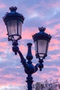 Lampposts with a sunset sky