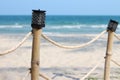 Lamps on bamboo fence posts on the beach Royalty Free Stock Photo
