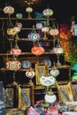 Lamps, candles, dishes and crafts in the street stalls of the medieval fair