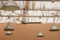 Lamps in metallic lamp shades hanging