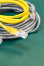 Lan cable with rJ45 connector, pair of coil wires yellow and gray Royalty Free Stock Photo