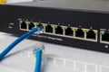 LAN network switch with ethernet cables plugging in Royalty Free Stock Photo