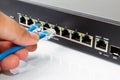 LAN network switch with ethernet cables plugging in Royalty Free Stock Photo