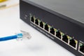 LAN network switch with ethernet cables plugging in Royalty Free Stock Photo