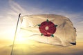 Lancashire county of England flag textile cloth fabric waving on the top sunrise mist fog