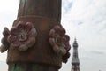 Lancashire red rose iron detail on a lamp post on north pier Blackpool with the Blackpool tower seen behind