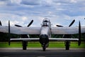 Lancaster bomber with four Merlin engines running.