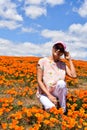 Lancaster, Ca / April 12, 2019 - Admiring the golden poppies in full bloom covering the hillsides in the Antelope Valley with brig Royalty Free Stock Photo